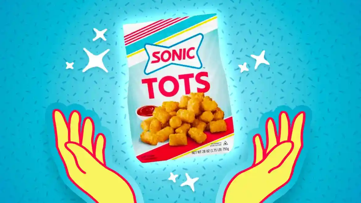 Bag of Sonic frozen tots in front of blue background with sparkles and hands on bottom delicately praising the bag of sonic frozen tots